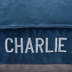 Frisco Personalized Navy Bolstered Bed With Navy Check Bolster -PetPalace Picks 311766 PT4. AC SS1800 V1630593985